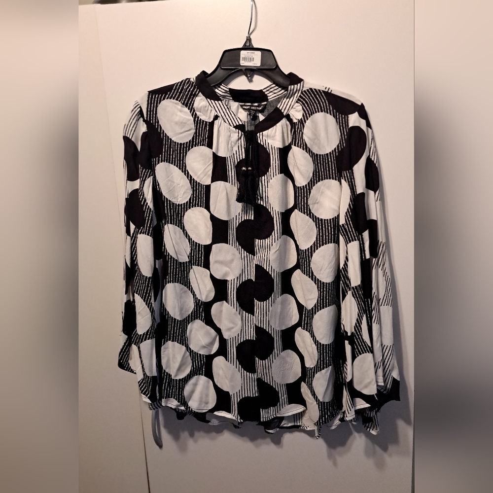 Black-and-white polka dot blouse